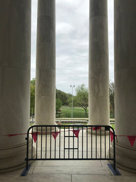 Columns from the Jefferson Memorial, closure barrier in foreground, Washington DC