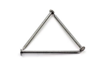 Three construction nails form a triangle on a white isolated background_