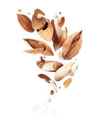 Crushed almonds frozen in the air isolated on a white background