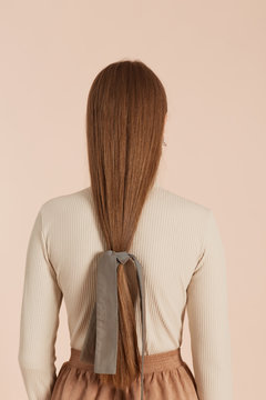 Elegant Long-haired Girl Back View