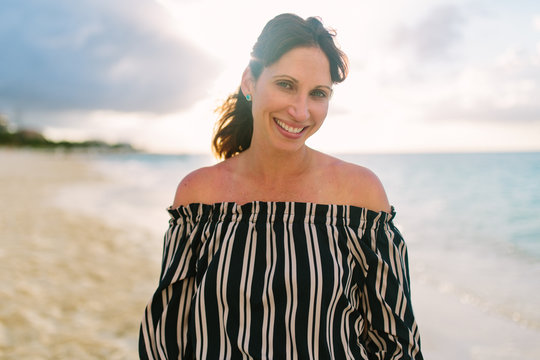 Portrait Of A Beautiful Woman In A Summer Dress On The Beach