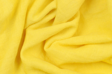 close up crumpled yellow cotton fabric background