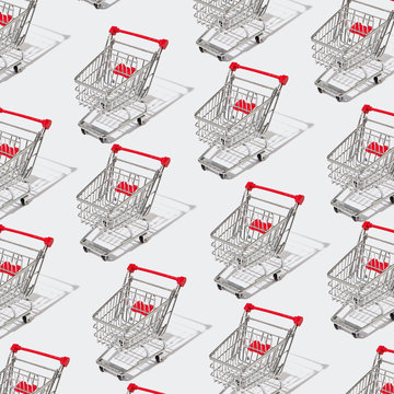 Collection of shopping carts with a red pen presented on a white background with a pattern of tenney. The concept of buying. Flat lay