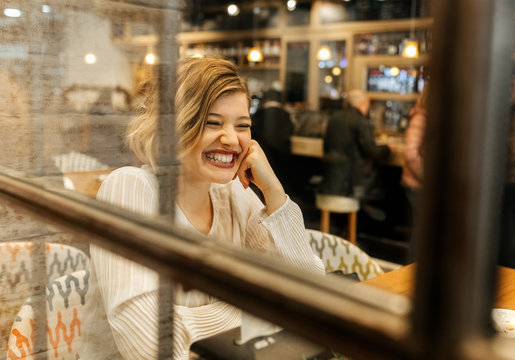 Beatiful blond woman at a cafe