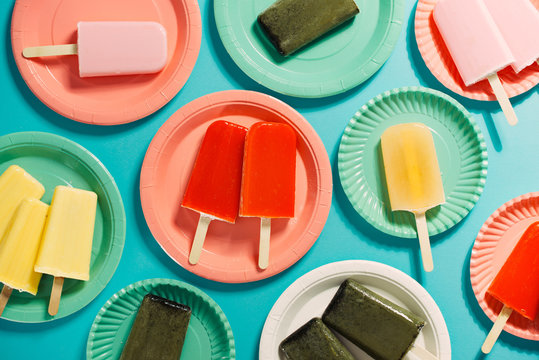 Overhead View Of Fruit Popsicles On Plates