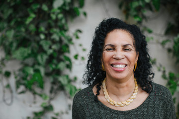 Joyful, happy mature woman outside.
