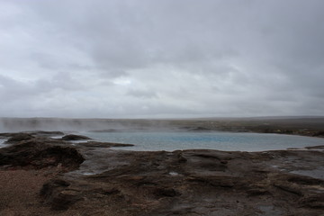 The original geysir in Iceland on a cloudy day