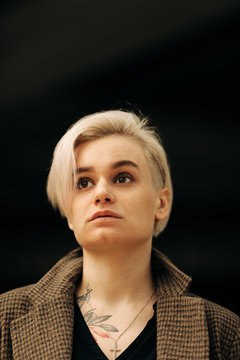 Portrait Of Young Blond Androgyne Woman On The Street