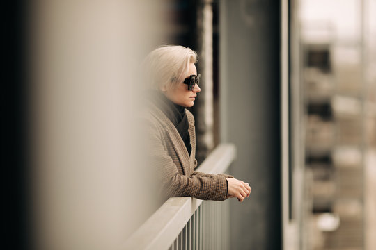Portrait Of Young Blond Androgyne Woman With Big Sunglasses