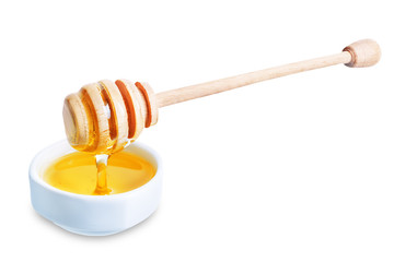Honey in white bowl on a white isolated background
