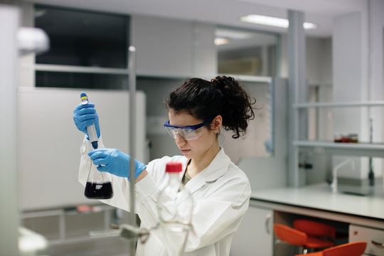 young woman doing chemical experiments
