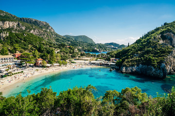 Azure waters of Ionian sea and golden beach Agios Spiridon in Palekastrica, Corfu.