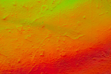 Beautiful bright colorful street art graffiti background. Abstract creative spray drawing fashion colors on the walls of the city. Urban Culture, pink , red , orange , green, crimson , purple texture
