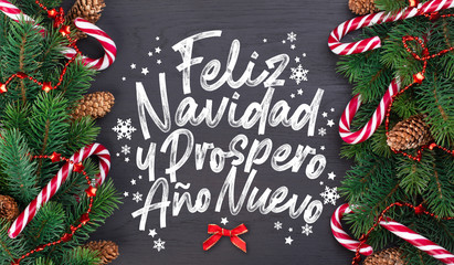 Christmas card with wishes words in Spanish "Merry Christmas and a happy new year!"