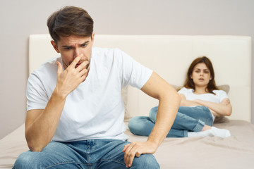 couple sitting on sofa at home