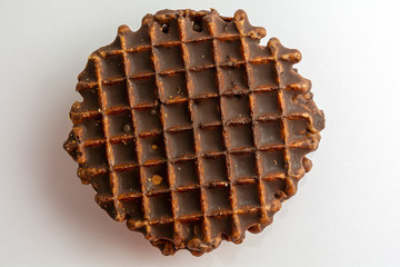 Belgian round waffles with chocolate. Topping on a light background. Dessert concept. View from above.