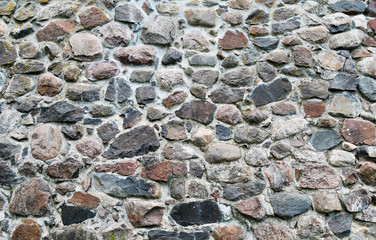 Stone wall background. Texture of old masonry. Monochrome background.