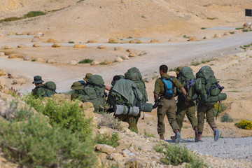 Squad of Israeli elite unit.  Soldiers training in the desert. Israeli army combat soldiers return...
