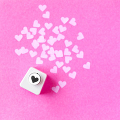 Decoration for Valentine's Day, hole puncher made paper shapes of pink hearts