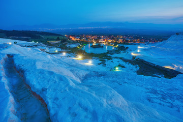 Pamukkale - amazing natural site with white terraces of travertine in Denizli Province, Turkey.