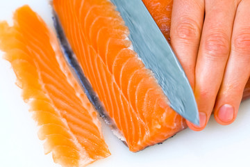 Butchering salmon, piece of salmon red fish meat.