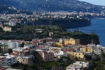 Daylight aerial view of cliff coastline Sorrento and Gulf of Naples in Southern Italy.