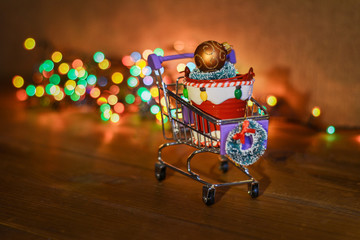 supermarket trolleys with New Year toys and gifts. Photo to illustrate the New Year, Christmas sale.