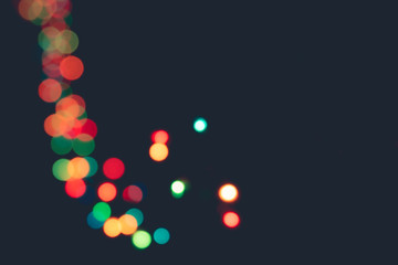 Blurred bokeh lights on black background. Decorated for Christmas and New Year