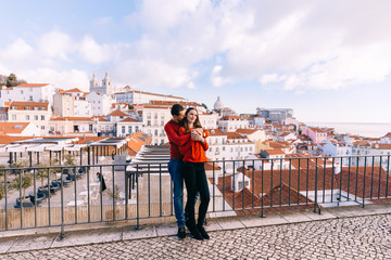 Obraz na płótnie Canvas Lisbon, Portugal - 20 January, 2019. the guy hugs the girl from