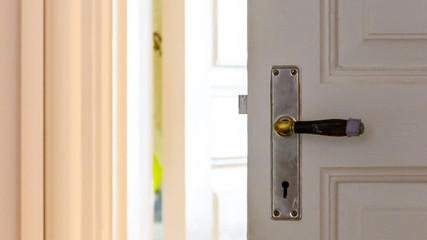 Old fasioned door handle on white door