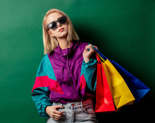 Style woman in 90s punk clothes with shopping bags