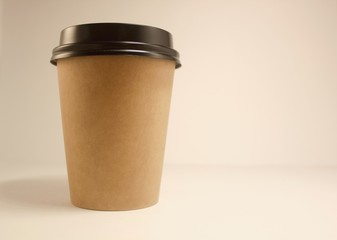 Paper Cup with coffee on a white background, copy space