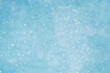 Winter christmas background, blizzard, snowfall. Winter landscape with falling shiny snow