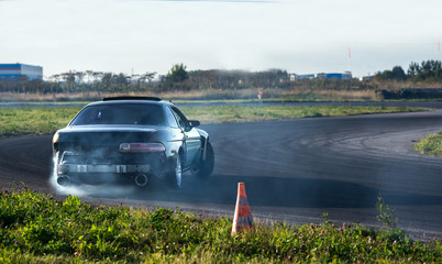 a sports car enters a turn by drift © Василий Дробышев