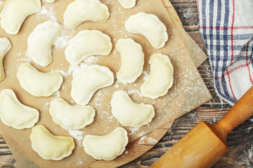 The process of cooking traditional vareniki - textured background	