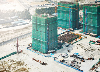 View of construction site during winter at Mal?, Maldives seen through airplane window
