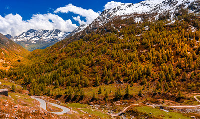 Autumn road view of Gran Paradiso Italian alps mountains in Graian Alps in Piedmont, Italy with snow capped peaks.