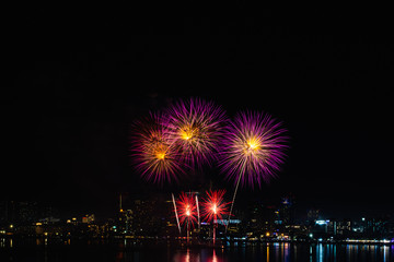 Beautiful fireworks against the background as over city scape view of night city in Thailand.