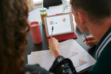 Close-up of young business people having a meeting in office