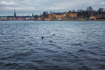 A sunken vintage wooden sailboat and ship in the water