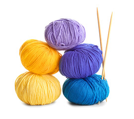 Knitting yarns and needles on white background