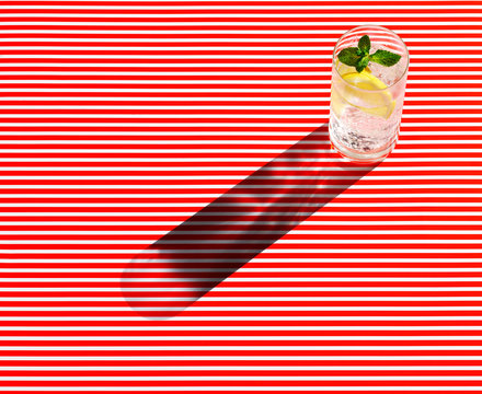 High angle view of gin served on striped table