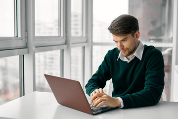 Fototapeta premium businessman working on laptop in office