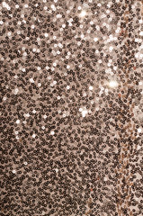 Fototapeta premium Dark gold sequins fabric pattern texture. Fashion abstract background for design.