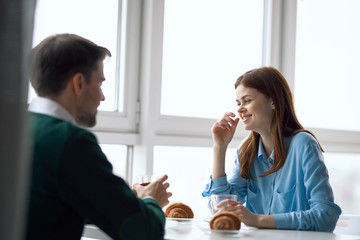 young couple having breakfast at home