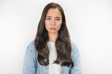 Close up portrait of emotional woman with offended face isolated over white background