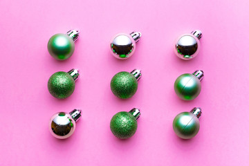 Christmas background. Xmas balls isolated on pink. Bubble pattern decoration. Flat lay. Winter concept