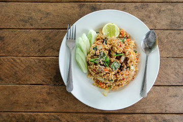 Fried rice chicken egg and vegetable carrot chinese kale green onion and cucumber on plate - thai food