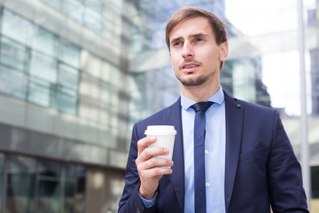 Portrait of cheerful male standing outdoor
