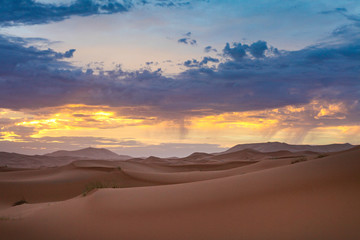Fototapeta na wymiar Landscape of a desert and magical clouds